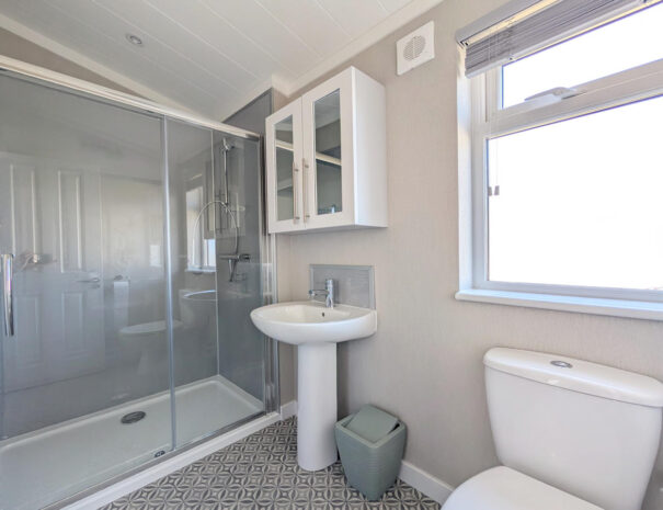 Spacious shower room with walk in shower.