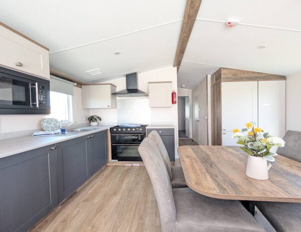 Spacious kitchen and dining area with integrated appliances.