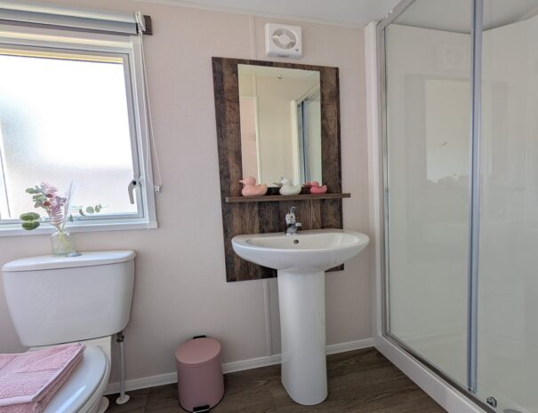 Spacious shower room with toilet and basin unit.