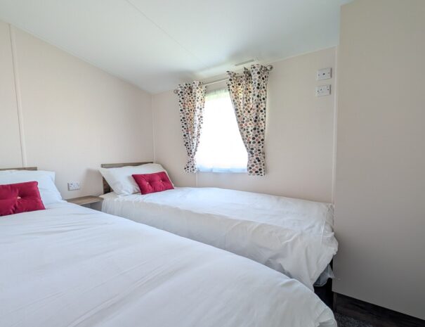 Twin bedroom with built in wardrobes